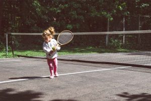 Small child with a tennis racket